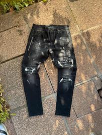 Jeans neri slim fit con zip e scritte