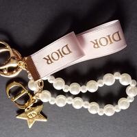 Portachiavi Dior perle e monogramma