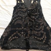 Blusa con anello davanti con brillantini