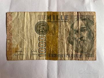 sped.e0,99 banconota 1000 lire anni 70 danneggiata
