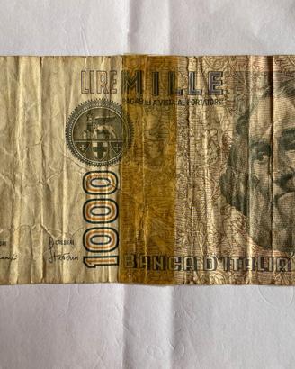 sped.e0,99 banconota 1000 lire anni 70 danneggiata
