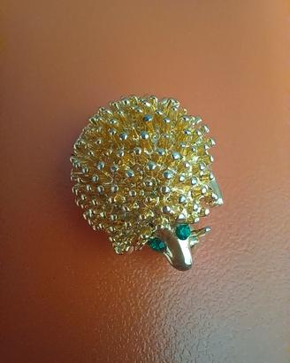 Spilla vintage riccio "BP" anni 70/80 dorata 