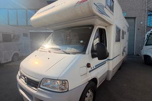 camper mansardato Adria coral con letto matrimonia