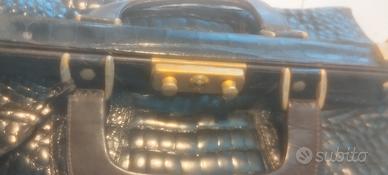 valigia vintage in coccodrillo