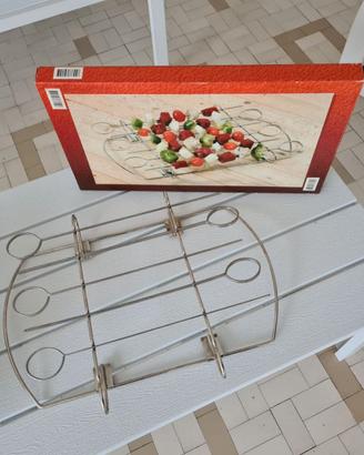 Supporto giraspiedini per barbecue