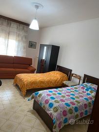 Stanza singola + balcone + posto auto