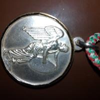 medaglia in argento con contorno oro 