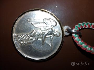 medaglia in argento con contorno oro 