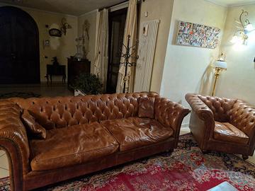 Divano e poltrona in pelle color cuoio