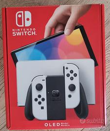 Nindendo switch oled + sei giochi + 4 joystich