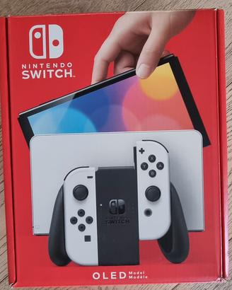 Nindendo switch oled + sei giochi + 4 joystich