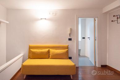 Nio - Divano letto pieghevole 2 posti giallo senap