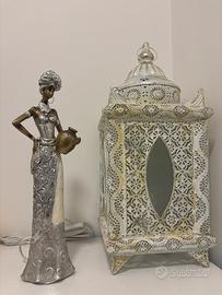 Lanterna marocchina e statuetta di donna tribale
