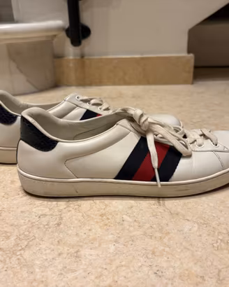 Sneakers Gucci Ace in pelle bianca con nastro Web
