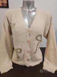 Gilet con fiocchi oro