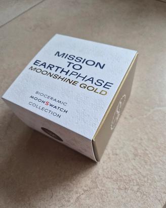 Omega swatch mission to earthphase moonshine gold 