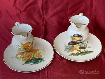 Brocche da vino e piatti artigianali con funghi