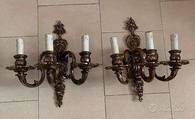 Applique dorate a tre luci in ottone