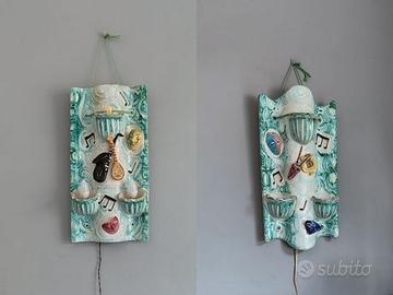 Coppia di applique in ceramica