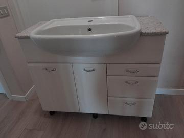 lavabo con piano in marmo rosa e mobiletto 