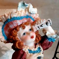 Porcellana su altalena