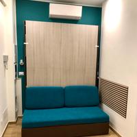 Letto a ribalta con divano e materasso