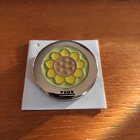 Gancio portaborse Country con Girasole
Thun
