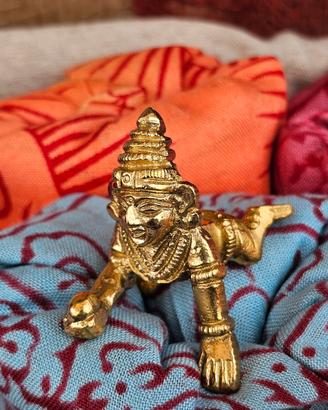 Statuetta Krishna bambino che gattonа in ottone