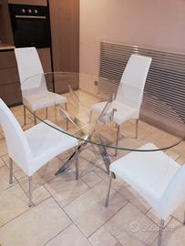 tavolo in cristallo ellittico piu 4 sedie in pelle