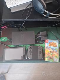 Nintendo switch + gioco + custodia (descrizione)