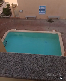 Trilocale con piscina e giardino