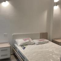 Struttura letto con due comodini