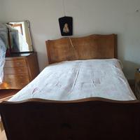 contorno letto matrimoniale di legno