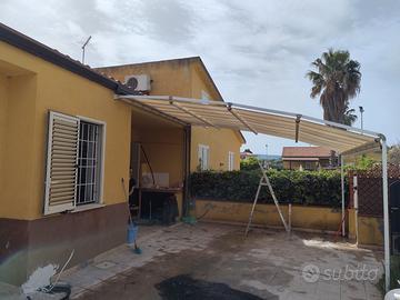 Tenda da sole retrattile con piedi