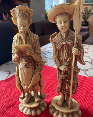 Coppia statuette orientali in pasta di resina Vint