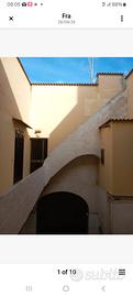  Casa + magazzino+ una striscia di terreno 