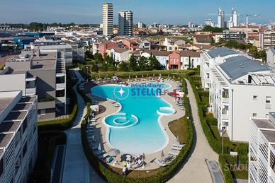 Laguna Park # bilocale + [piscina]