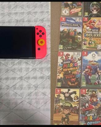 Nintendo Switch OLED con giochi e accessori