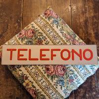 Insegna "Telefono"