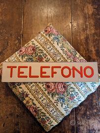 Insegna "Telefono"