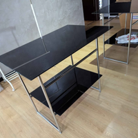 Tavolino in acciaio e vetro