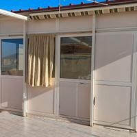veranda con una parte finestrata