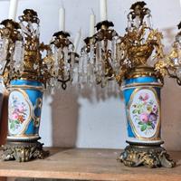 Due candelabri antichi in bronzo e porcellana