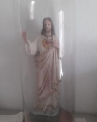 Statua sacra antica con campana vetro