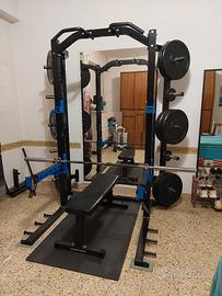 Rack + Panca Piana + Bilanciere + Pesi + Tappeto