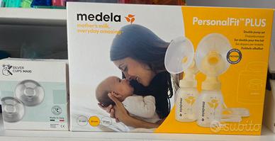 Tiralatte Medela e coppette in argento