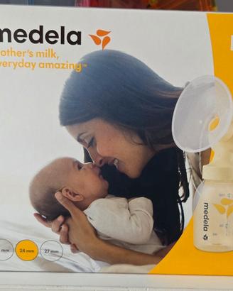 Tiralatte Medela e coppette in argento