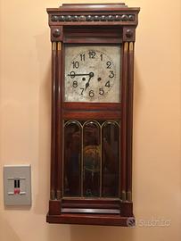 Orologio a dondolo a parete antiquariato