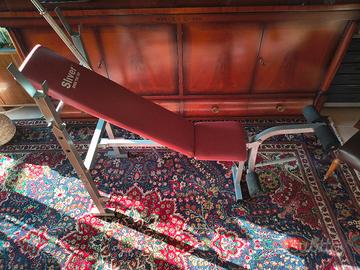 Panca regolabile con bilanciere e dischi