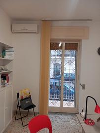 Stanza in studio condiviso